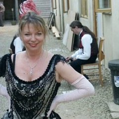 Helen Moran in costume, backstage during rehearsals for La Boheme